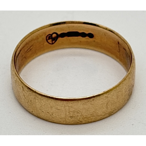 1076 - A 9ct gold 6mm wide band ring fully hallmarked inside band. Size R½, weighs approx. 3.4g.