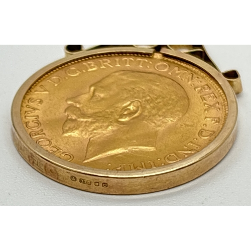 1005 - A 1926 George V gold sovereign in a 9ct gold pendant mount with scroll detail to top. On a 26