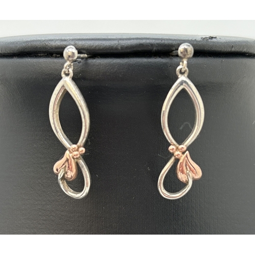 1100 - A Clogau silver bangle, pendant necklace and matching drop earrings with classic ivy leaf design and... 