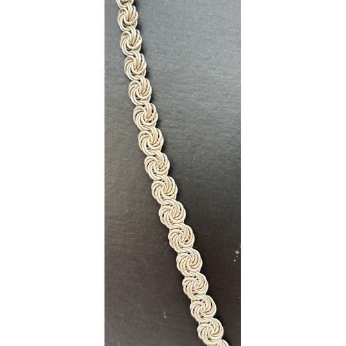 1103 - A heavy 24 inch decorative silver multi spiral link chain necklace with lobster claw clasp. Silver m... 