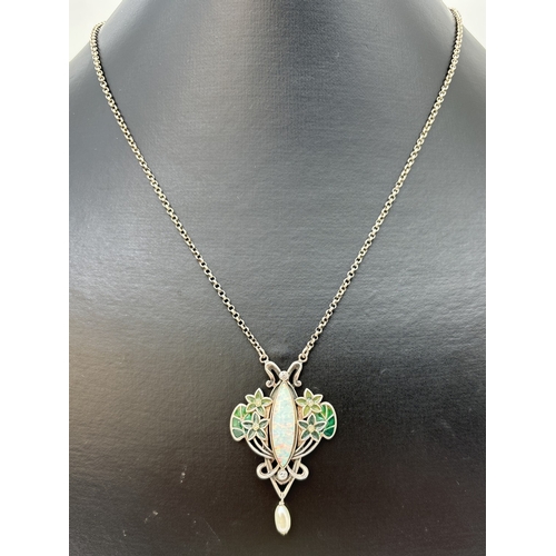 1108 - A boxed Art Nouveau design floral style pendant necklace with enamel detail. Set with a marquise cut... 