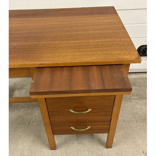 1410 - A vintage teak 3 drawer desk with pull out tray and lockable top draw (comes with key).  Approx. 74c... 