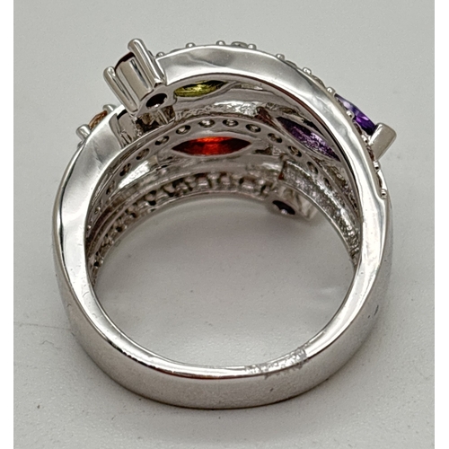 1122 - A multi band crossover design cocktail ring set with coloured & clear Swarovski crystals. In a rhodi... 