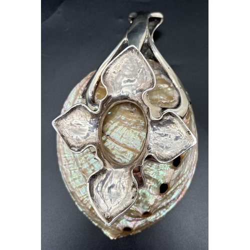 1201 - An Art Nouveau/Arts & Crafts silver and shell dish with foliate style quatrefoil foot and open work ... 