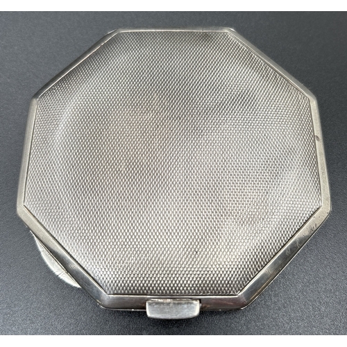 1202 - A vintage silver RAF sweetheart compact with guilloche design to lid. Octagonal shaped with swirl de... 