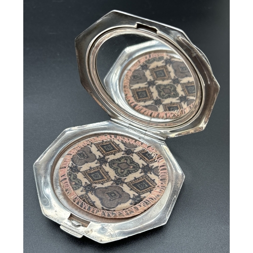 1202 - A vintage silver RAF sweetheart compact with guilloche design to lid. Octagonal shaped with swirl de... 