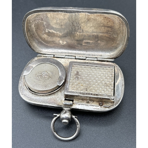 1205 - An Edwardian silver Walker & Hall combination sovereign holder and stamp case. With hinged opening c... 