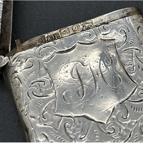 1219 - 2 Victorian silver vesta cases with engraved scroll & foliate design & empty shield shaped cartouche... 