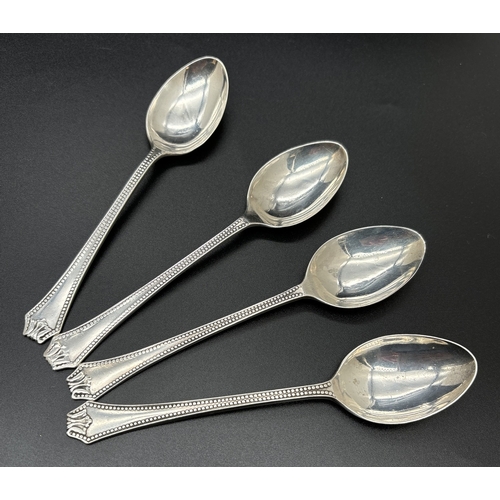 1223 - A set of 4 Art Deco silver tea spoons with beaded design to handles. Each fully hallmarked to unders... 