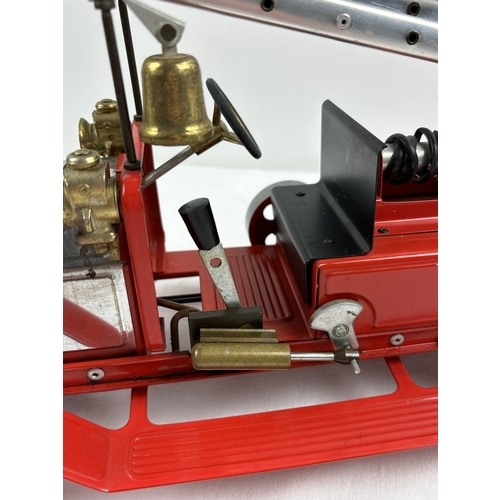 A Mamod FE1 steam powered model fire engine, unboxed, with red
