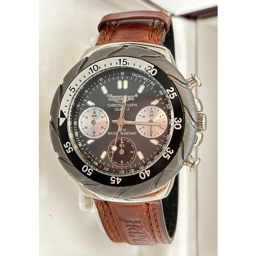 1170 - A boxed Triumph Motorcycles chronograph quartz wristwatch with rotating bezel. Stainless steel case ... 