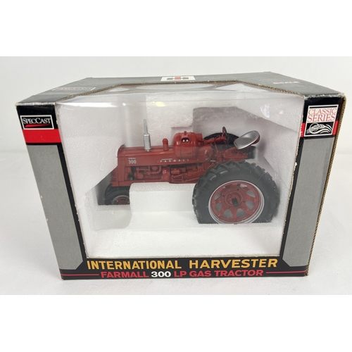 A boxed Speccast 1/16 scale diecast model of an International Harvester Farmall 300 LP Gas tractor. In as new unopened condition.