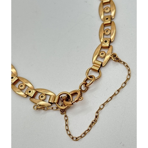  A 9ct gold decorative link bracelet with spring clasp and safety chain. Clasp stamped 9K. 375 marks ... 