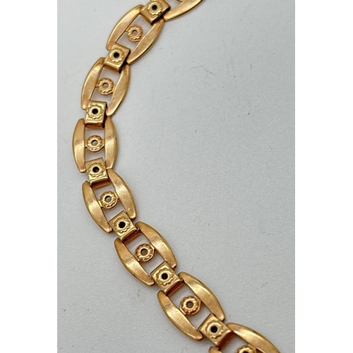  A 9ct gold decorative link bracelet with spring clasp and safety chain. Clasp stamped 9K. 375 marks ... 