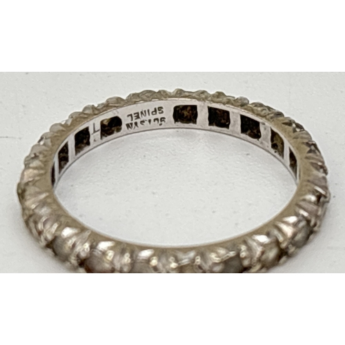 66 - A vintage 9ct white gold full eternity ring set with white spinel stones. Gold marks inside band. Si... 