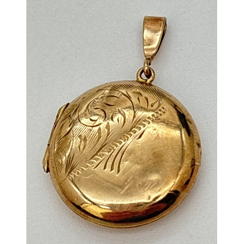 68 - A small circular 9ct gold locket with half floral engraved decoration to front. Hallmarked to back. ... 