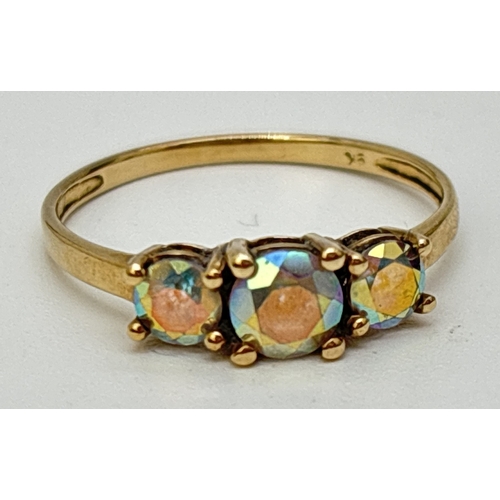 77 - A 9ct yellow gold trilogy ring set with 3 mystic topaz stones. Inside of band marked 9K. Size P. Tot... 