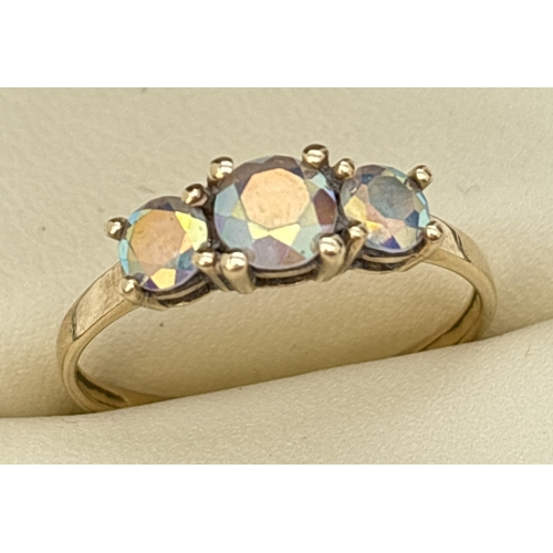 77 - A 9ct yellow gold trilogy ring set with 3 mystic topaz stones. Inside of band marked 9K. Size P. Tot... 