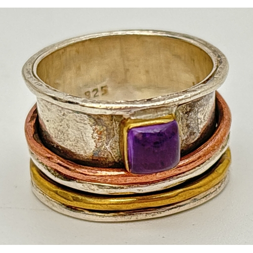 90 - A 925 silver band ring set with a square cut amethyst and silver, copper and brass spinner rings. Ap... 