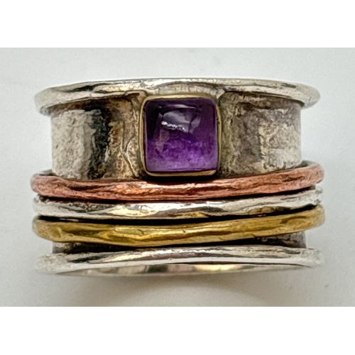 90 - A 925 silver band ring set with a square cut amethyst and silver, copper and brass spinner rings. Ap... 