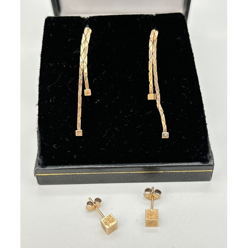 95 - 2 pairs of 9ct gold earrings. A pair of double drop earrings with cube detail to ends together with ... 