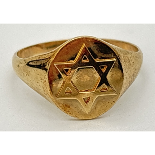 98 - A 9ct gold signet ring with embossed Star Of David. Gold marks inside band. Size T, weight approx. 3... 