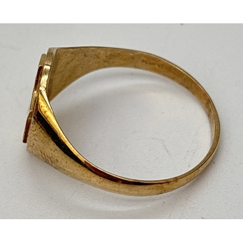 98 - A 9ct gold signet ring with embossed Star Of David. Gold marks inside band. Size T, weight approx. 3... 