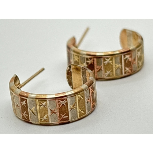 127 - 2 pairs of yellow gold earrings. A pair of knot studs together with a pair of tri coloured gold half... 