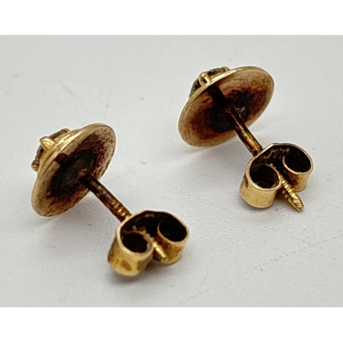 133 - A pair of bespoke made yellow gold diamond set stud earrings with butterfly screw backs. Circular st... 