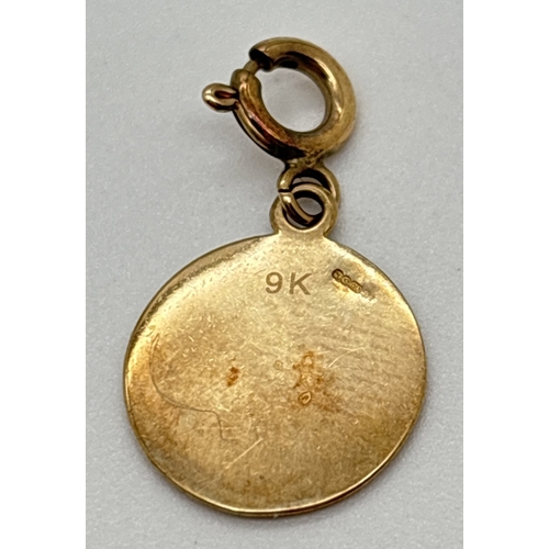 144 - A 9ct gold circular shaped 