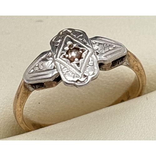 151 - An Art Deco 9ct gold and palladium ring set with a small round cut diamond. Gold marks inside band. ... 