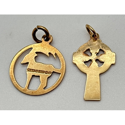 155 - 2 x 9ct yellow gold pendants. A circular Capricorn/goat pendant together with a Celtic cross pendant... 