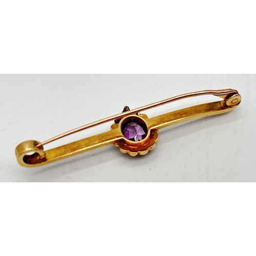 156 - A vintage 9ct gold bar brooch set with seed pearls and central oval cut amethyst. Unmarked but tests... 