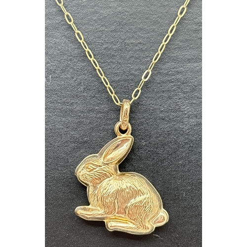 169 - A 9ct gold rabbit pendant on a 16