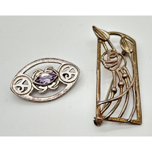 172 - 2 silver Rennie Mackintosh style brooches. A marquise shaped brooch with pierced work design and cen... 