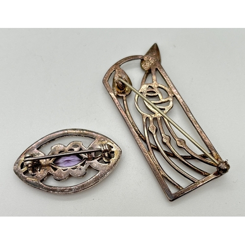 172 - 2 silver Rennie Mackintosh style brooches. A marquise shaped brooch with pierced work design and cen... 