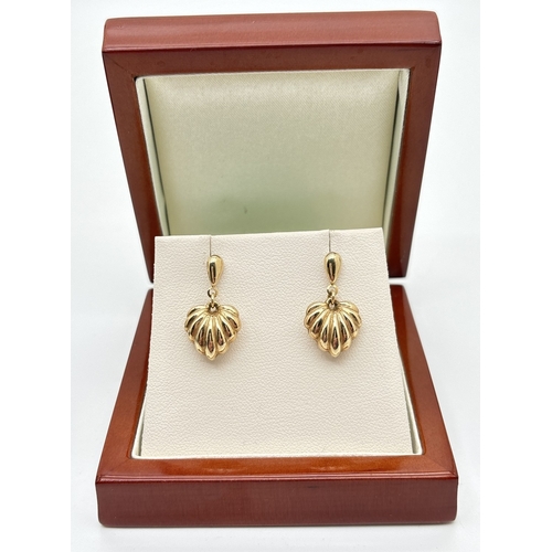 176 - A pair of 9ct yellow gold bubble heart drop earrings. Unmarked but test as 9ct gold. Approx. 2.5cm l... 