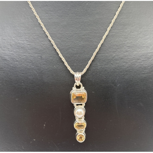 1003 - A modern design silver drop pendant necklace set with square, oval and round cut citrines & a round ... 