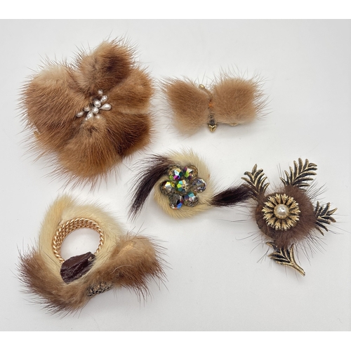 1010 - A collection of vintage real fur brooches and dress clips in various sizes and designs. Largest appr... 