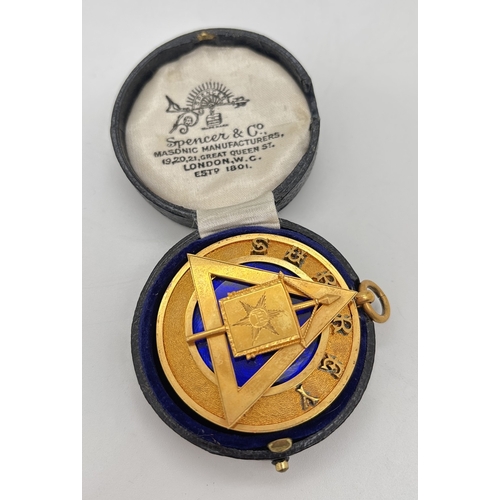 A vintage cased Grand Rank Masonic collar jewel for Surrey Lodge, from Spencer & Co. Masonic Manufacturers, London. Bright gold tone jewel with blue glass underlay. Makers name to back. Approx. 4.5cm diameter.