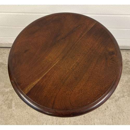 1379 - A vintage dark oak circular topped side/lamp table with chunky turned pedestal base. Approx. 55cm ta... 