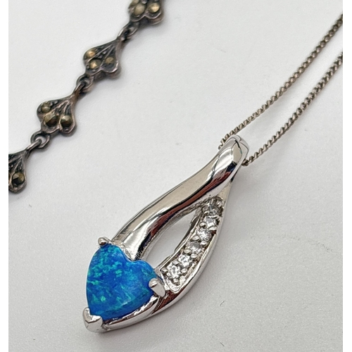 1050 - 2 items of silver jewellery. A twist design pendant set with heart shaped opalite and clear stones, ... 