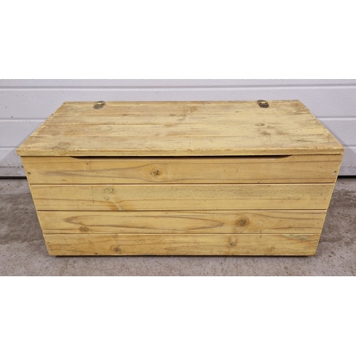 1380 - A vintage slatted pine box, painted yellow, with hinged lid and cut-out handles. Approx. 37.5cm tall... 