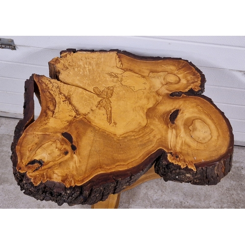 1381 - A rustic wooden occasional table made from a large slice of tree trunk. Approx. 74cm tall x 75cm wid... 