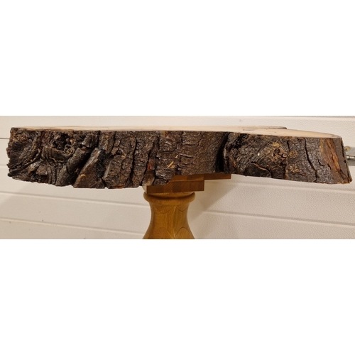 1381 - A rustic wooden occasional table made from a large slice of tree trunk. Approx. 74cm tall x 75cm wid... 