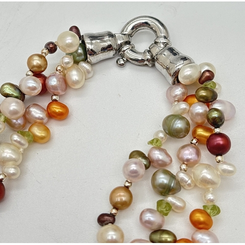 1078 - A 3 strand multi coloured freshwater pearl and peridot chip necklace with large white metal spring r... 