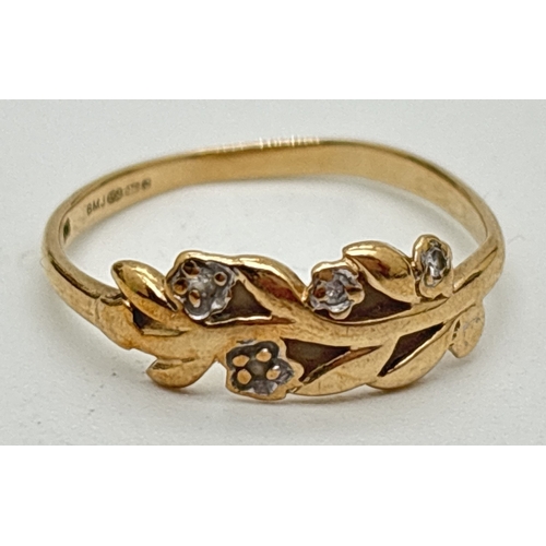 1092 - A 9ct gold delicate dress ring in a flower and leaf design, set with 4 small round cut diamonds. Hal... 