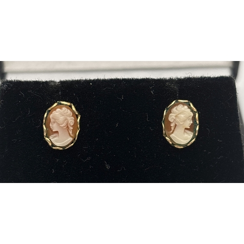 1097 - A small pair of oval shaped cameo set yellow gold stud earrings. Unmarked but test as 9ct. Total wei... 