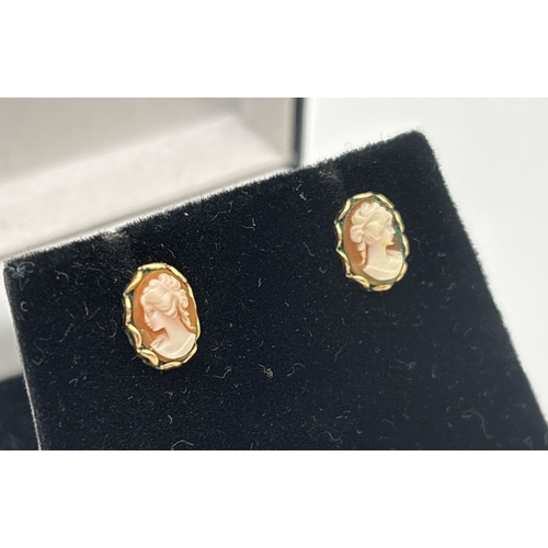 1097 - A small pair of oval shaped cameo set yellow gold stud earrings. Unmarked but test as 9ct. Total wei... 