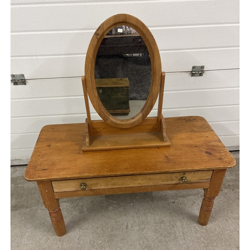 1386 - A vintage pine low table with turned legs and draw with brass knob handles, together with an oval sh... 